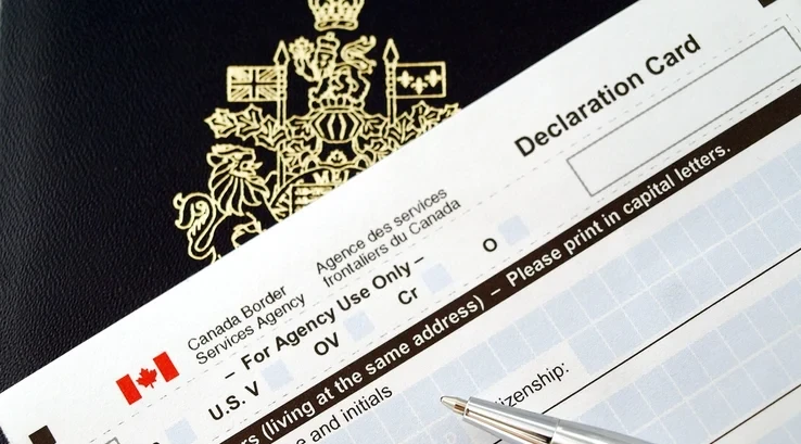 Canada Border Services Agency declaration card and passport
