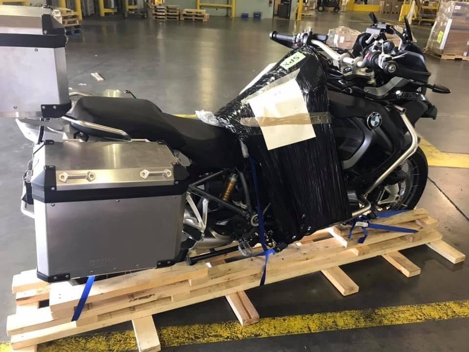 Motorcycle secured on a pallet ready for ocean freight shipping